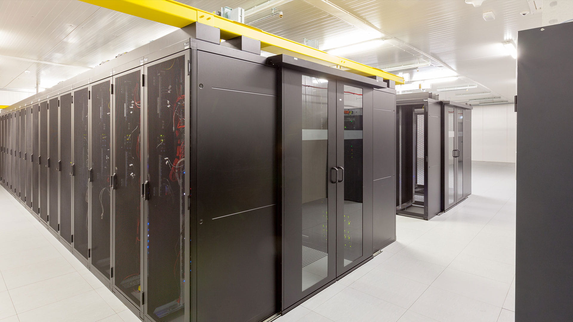 A tier data centre with rows of server racks